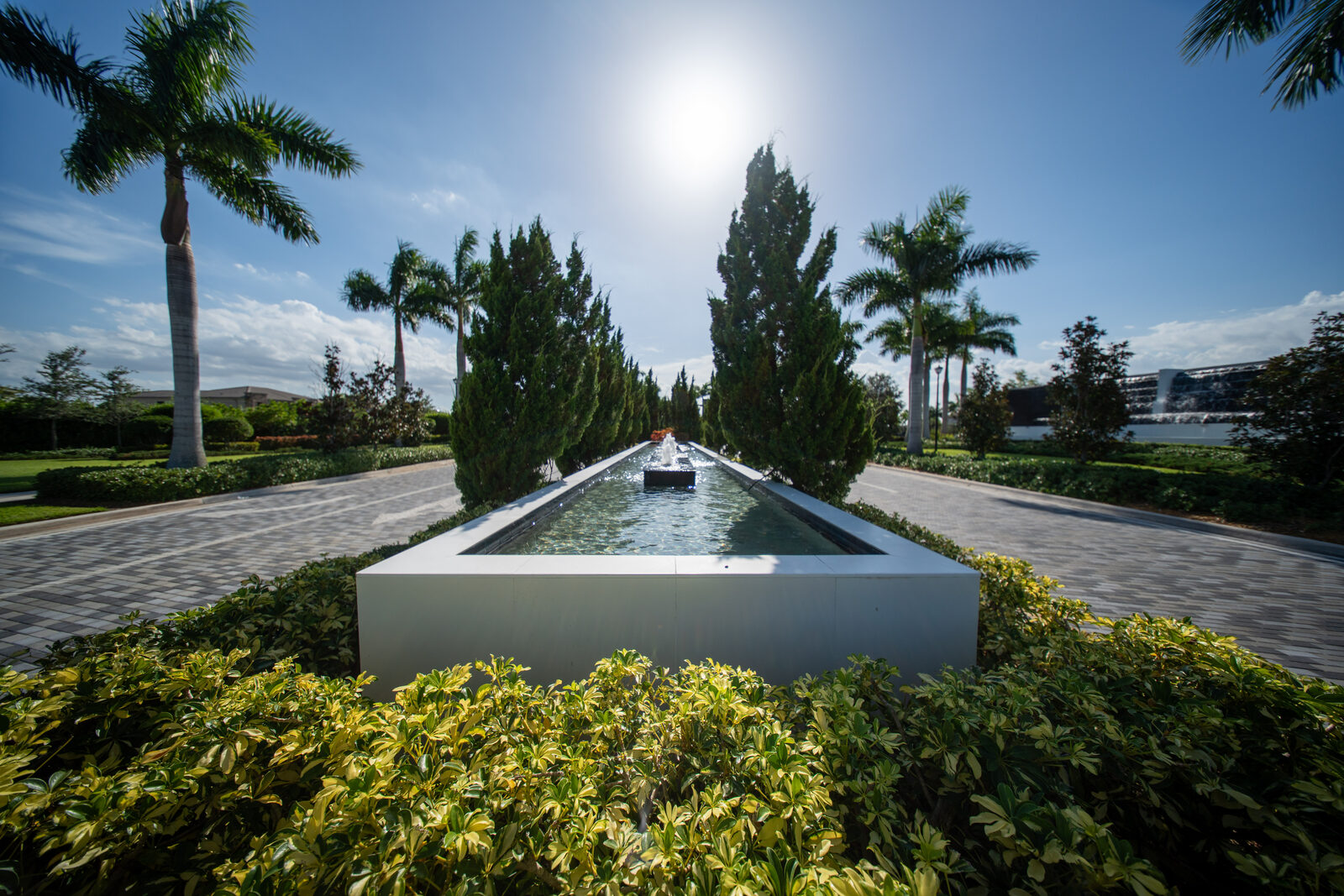Long reflecting pool along a gated community entrance drive in Parkland, Florida