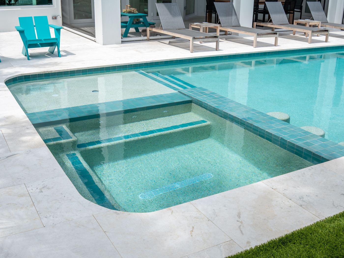 PebbleSheen White Diamonds with glass beads on a custom pool and spa in Boca Raton